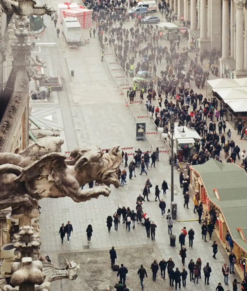 A patterned public space filled with people